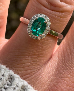 Emerald and Diamond Halo Cluster ring in 18ct White Gold